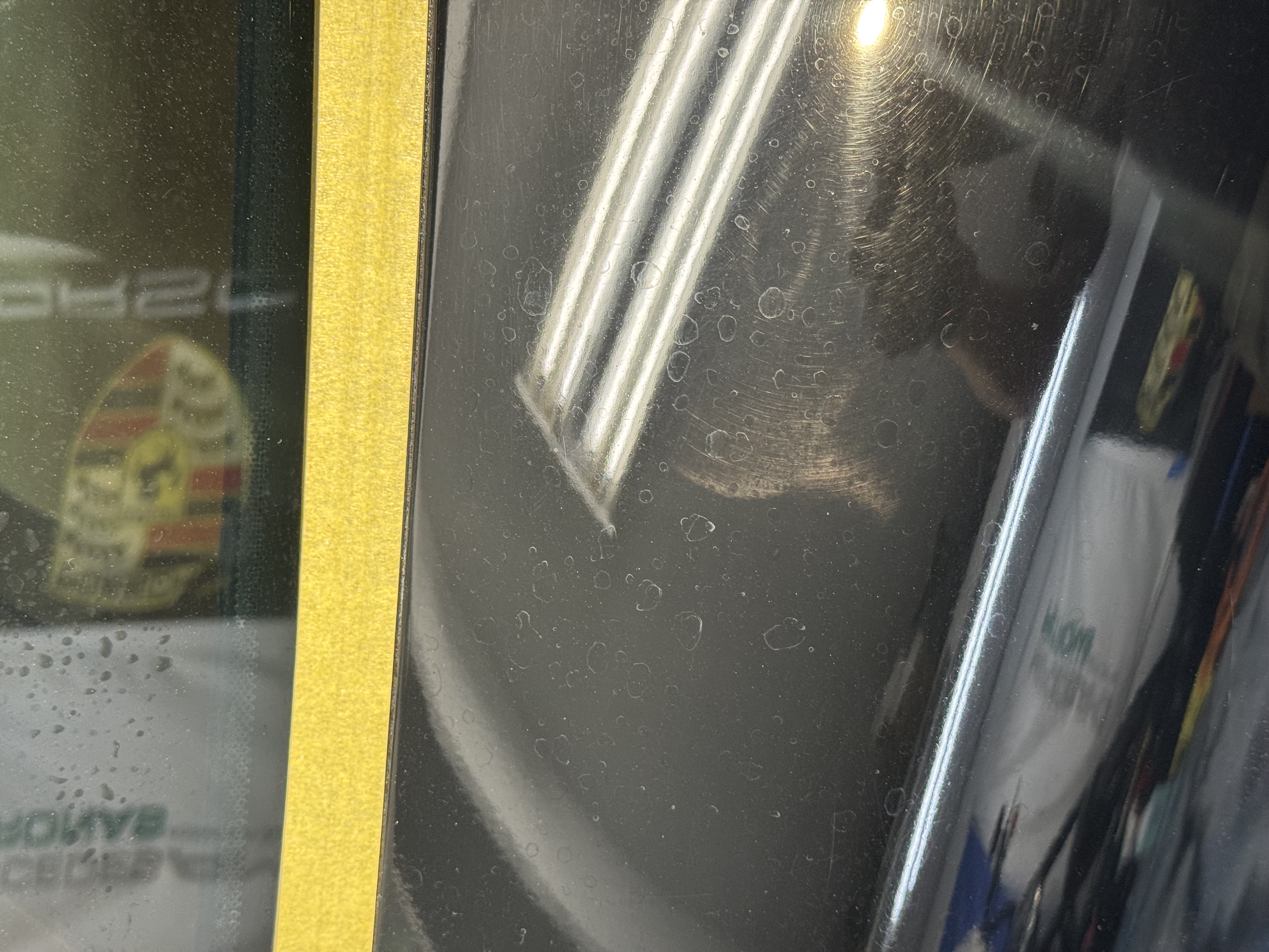 2002 Porsche 911 panel before paint correction — swirl marks and water spots
